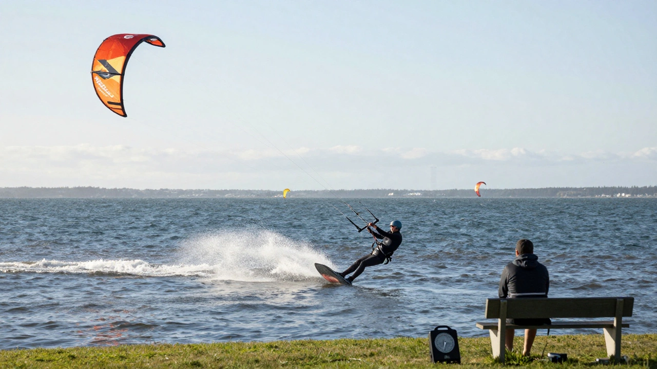 A kite pilot practicing the flick-flack into Jacob’s Ladder combo by a riverside, with wind sensors and metronome nearby.