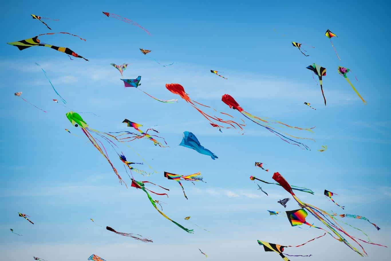 Multiple kites high in the sky