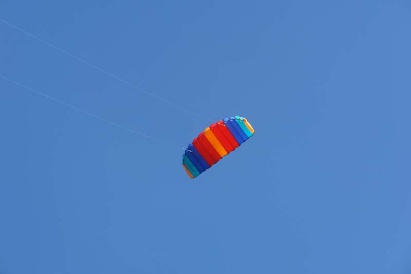 Red yellow blue Parafoil kite In blue sky